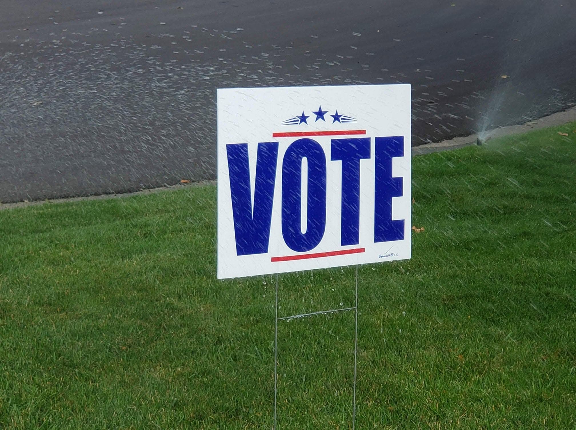 Vote yard sign on a lawn